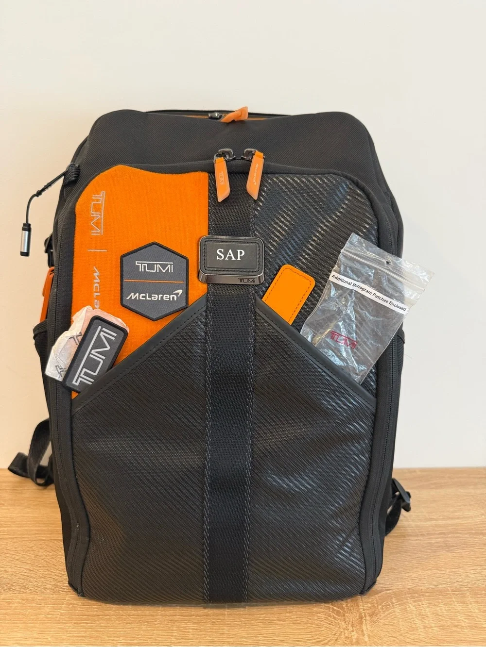 Tumi Black and Orange Men's Backpack with Detachable Travel Pouch